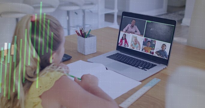 Writing child wearing yellow top joining online class at desk, laptop and notebook, copy space
