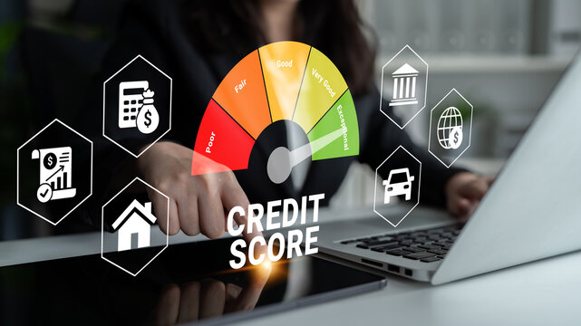 A business professional examines a credit score graphic on a laptop, surrounded by financial icons, highlighting the importance of personal finance in a modern office setting. Ledger