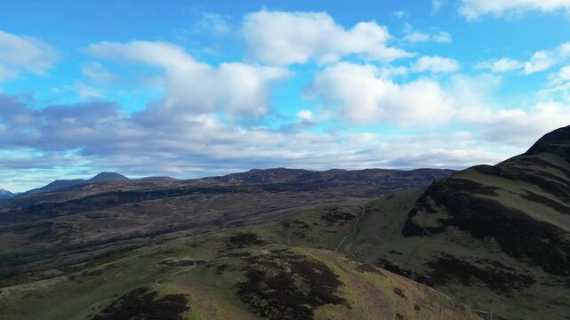 Aerial View of Balmaha Valley Glasgow Landscape over Mountains of UK During Sunset Time. The village is a popular tourist destination for picnickers and day trippers from Glasgow Scotland, UK