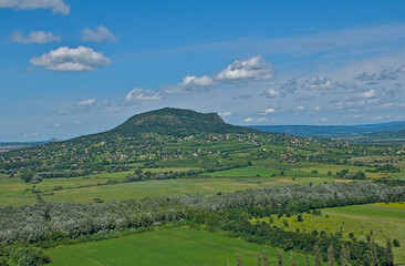 Obraz premium Sunny summer landscape with meadows and hills along Balaton lake on a sunny summer day near Keszthely, Hungary 