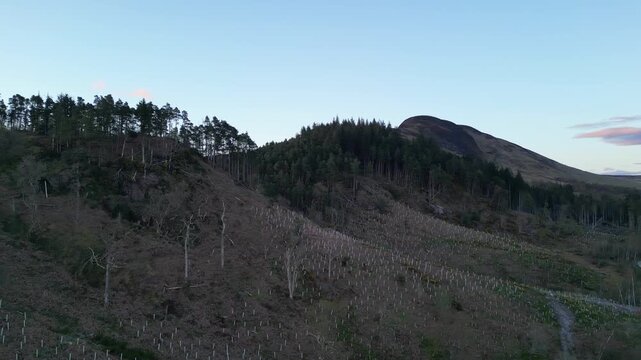 Aerial View of Balmaha Valley Glasgow Landscape over Mountains of UK During Sunset Time. The village is a popular tourist destination for picnickers and day trippers from Glasgow Scotland, UK