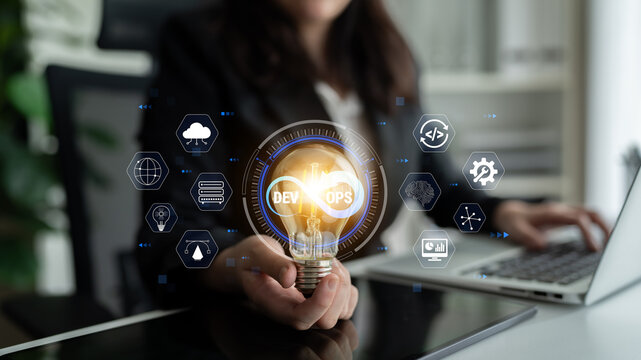 Professional Woman Holding Light Bulb with DevOps Icons Representing Innovation, Technology, and Collaboration in Modern Workspace Quark.