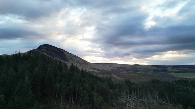 Aerial View of Balmaha Valley Glasgow Landscape over Mountains of UK During Sunset Time. The village is a popular tourist destination for picnickers and day trippers from Glasgow Scotland, UK