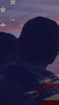 Vertical video: Sunset shifting man gazing mate leaning flag overlay emerging over sea finding calm