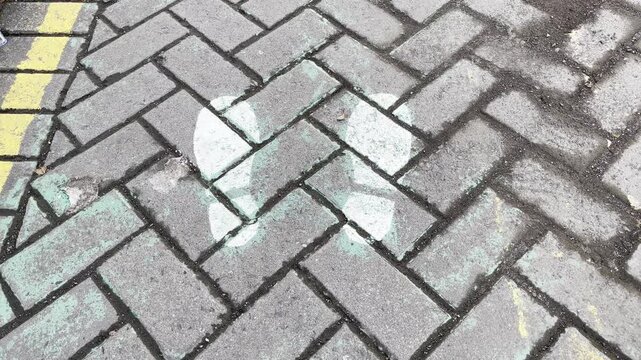 Herringbone Pattern Pedestrian Walkway with Yellow Safety Line