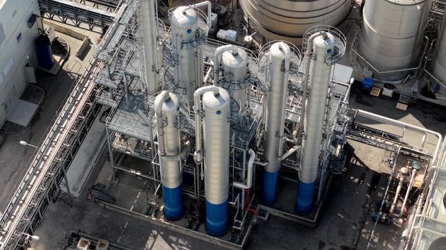 Aerial view of Sedamyl Industrial Factory with tall distillation columns and large storage tanks under bright sunlight in Selby, England, United Kingdom.