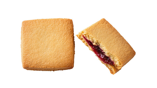Square shortbread cookies filled with red jam, isolated on transparent background