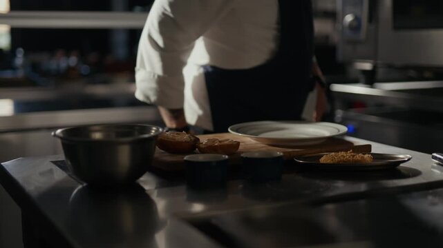 Chef stirs ingredients with focused precision. Kitchen tools gleam under warm, ambient lighting. Dish prep is methodical, professional, and calming. Ideal for culinary branding or food prep tutorials