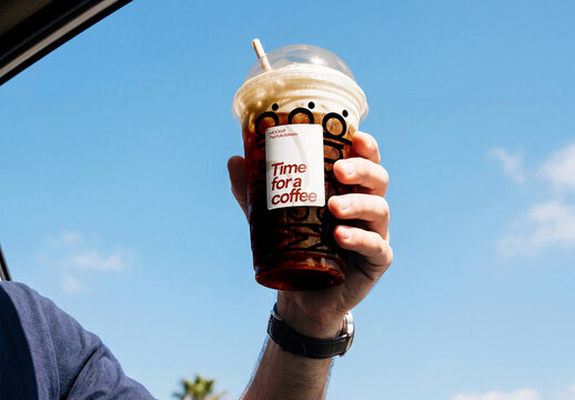 Plastic Coffee Cup in Hand Mockup