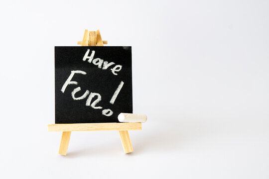 easel with message have fun on canvas