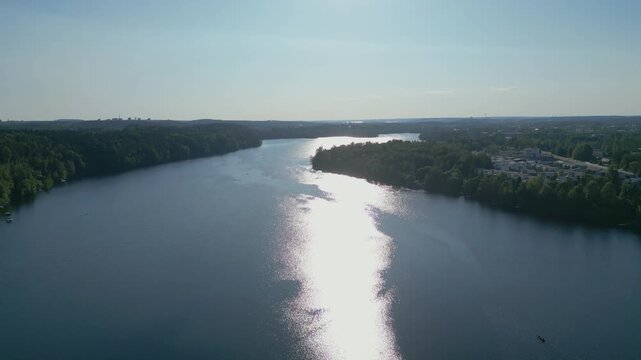 Aerial drone footage of the scenic Kaukaj&auml;rvi beach area in Kangasala, Finland during a bright summer day.