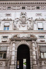 Obraz premium Late-Renaissance palace Bentivoglio (from 1449) is located on Via Garibaldi. Bentivoglio decorated the facade with military trophy symbols in marble. Ferrara, Region of Emilia-Romagna, Italy.
