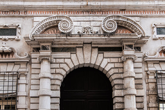 Late-Renaissance palace Bentivoglio (from 1449) is located on Via Garibaldi. Bentivoglio decorated the facade with military trophy symbols in marble. Ferrara, Region of Emilia-Romagna, Italy.
