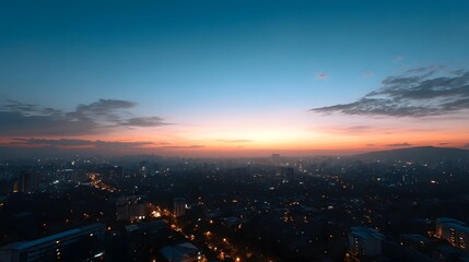 Fototapeta premium Sweeping panoramic view of a sprawling metropolitan cityscape bathed in the soft transitional glow of dawn or dusk
