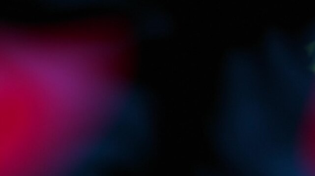 Abstract light leak effect with glowing flares and magenta blue ripples. Dark background with blurred illumination for creative video transitions and overlays.