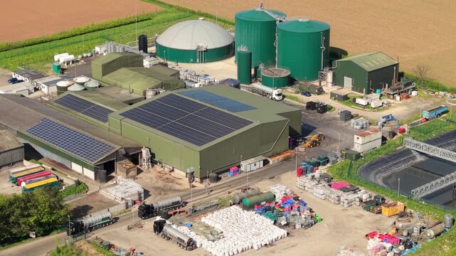Aerial view of Bioganix Ltd industrial facility with green storage tanks and solar panels on rooftops in Brigg, England, United Kingdom.