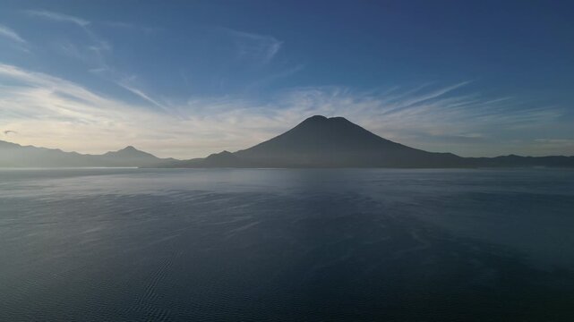 lake atitlan aerial drone footage (scenic volcanic lake with mountains background volcano volcanoes) santa cruz la laguna famous tourism destination latin america