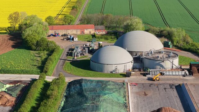 Aerial view of FBG Grange Farm Energy Spridlington biogas plant with large dome tanks and green fields in Market Rasen, England, United Kingdom.