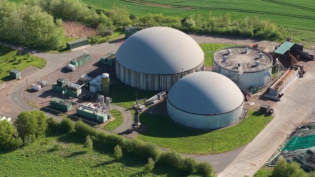 Aerial view of FBG Grange Farm Energy Spridlington biogas plant with large dome digesters and green fields in Market Rasen, England, United Kingdom.