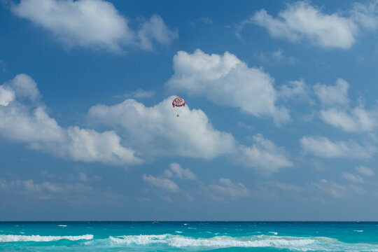 Two people parasailing