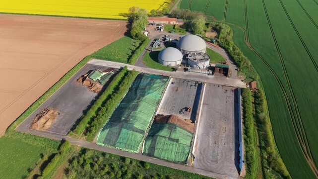 Aerial view of FBG Grange Farm Energy Spridlington biogas plant with storage domes and silage clamps surrounded by agricultural fields in Market Rasen, England, United Kingdom.