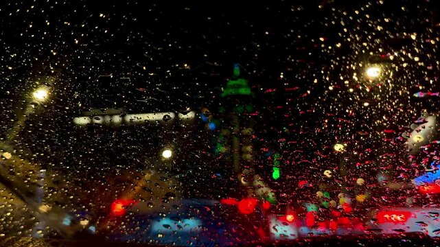Cinematic Rainy Night City Traffic View from Inside Car