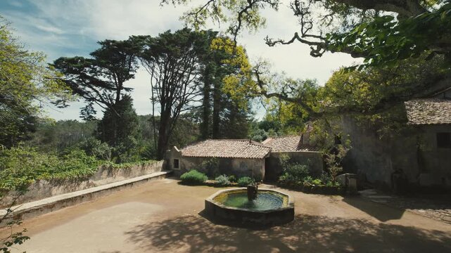Stone fountain in a rustic medieval convent courtyard