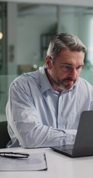 Laptop, think or business man in office for accounting report, tax update or reading finance email. Computer, mature person or accountant at work for problem solving, review budget or payroll process