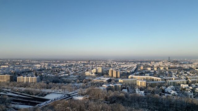 Aerial View of Snow Covered Munich Cityscape at Golden Hour, Germany, Winter Urban Landscape