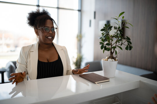 African american woman working as receptionist at office