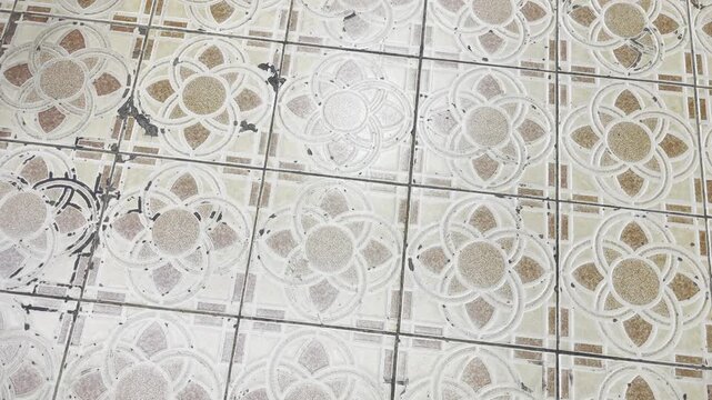 Vintage ceramic floor tiles with floral pattern