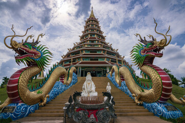 Fototapeta premium Giant white Guanyin statue and pagoda at Wat Huay Pla Kang temple in Chiang Rai, Thailand