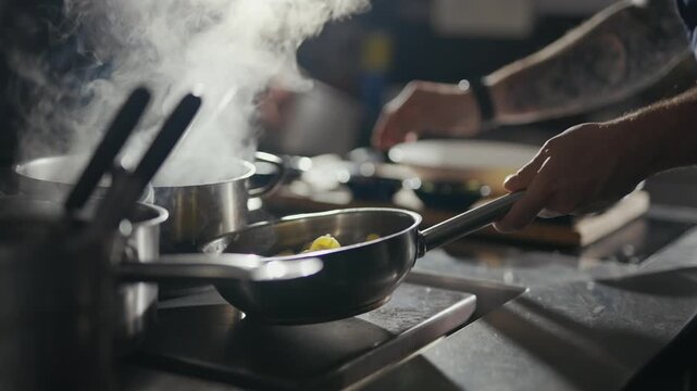Steam rises from a simmering pan. Hand holds a glowing flashlight against the mist. Cooking utensils rest beside steaming pots. Chef's arm shows tattoos, steady and focused