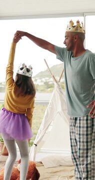 Dance, smile and ballet with father and girl in home for learning, support and fun bonding. Princess, fantasy and daughter with tutu and dad in house living room for playful, love and childhood laugh