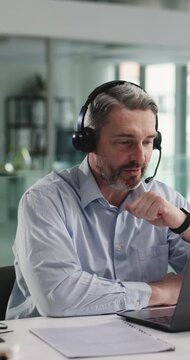 Laptop, call center and business man in office for banking support, advice or account assistance. Computer, talk or mature consultant with headset for loan inquiry, financial help or customer service