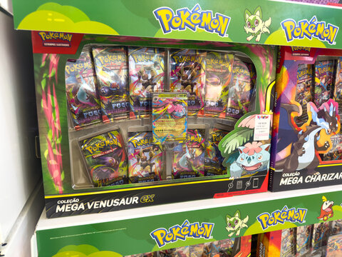 BELO HORIZONTE, MG, BRAZIL, APRIL 11, 2026 A detailed close-up shows a "Mega Venusaur EX" Pok&eacute;mon card collection box, filled with booster packs and special cards, on a store shelf.