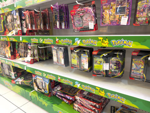 BELO HORIZONTE, MG, BRAZIL, APRIL 11, 2026 Multiple shelves are fully stocked with a diverse array of Pok&eacute;mon Trading Card Game products and collectibles in a retail store.