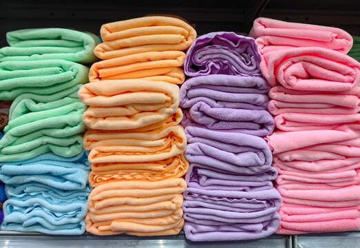 pile of Colorful neck towels in storage cabinet shelves