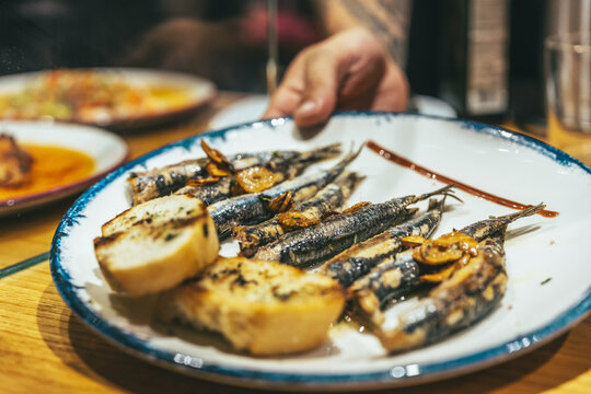 Traditional Basque pintxos sardines on plate close up