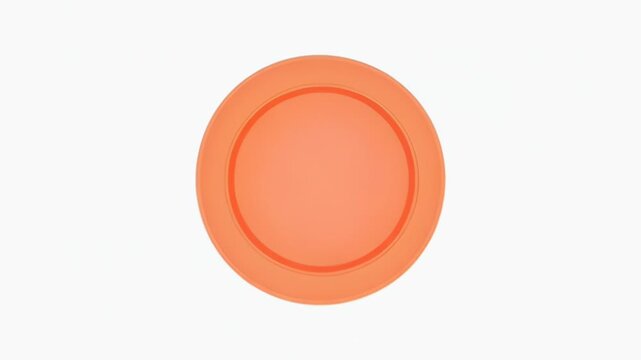 Bright orange circular disc in a minimalist studio setting with smooth surface.
