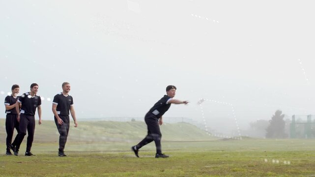 Seven men practicing team catch drills on foggy hillside, white square appearing, one leaping