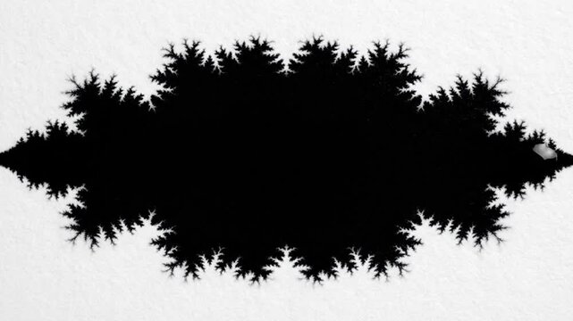 Abstract black ink blot on white textured paper background