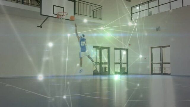 Male basketball player practicing sports, dribbling driving to hoop and scoring with light nodes