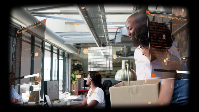 Man speaking in office walking to cardboard box while team checking box and HUD overlays floating