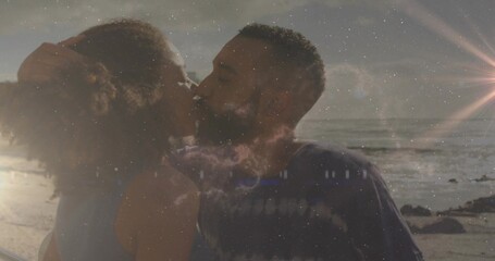 Fototapeta premium Kissing couple wearing sleeveless top and dark tee, leaning on rocky beach with nebula overlay