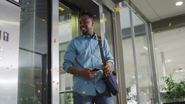 Lift opening, man exiting checking phone, woman joining, animated gold stars marking office arrival