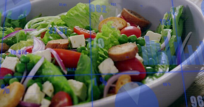 Showing white oval salad bowl holding lettuce, tomatoes, feta, croutons on table with blue overlays