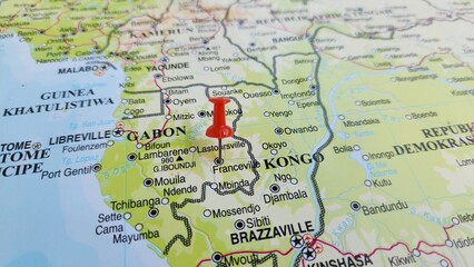 Naklejka premium View of Franceville, is one of the four largest cities in Gabon, west africa, on a geographical map of Africa, marked with red push pin