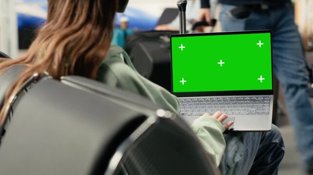 Isolated mockup with digital nomad working on laptop in busy airport lounge, with luggage near the departure gate. Location independent lifestyle with remote freelance job flexibility.