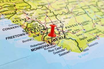 Obraz premium View of Monrovia, is the capital and largest city of Liberia, on a geographical map of Africa, marked with red push pin